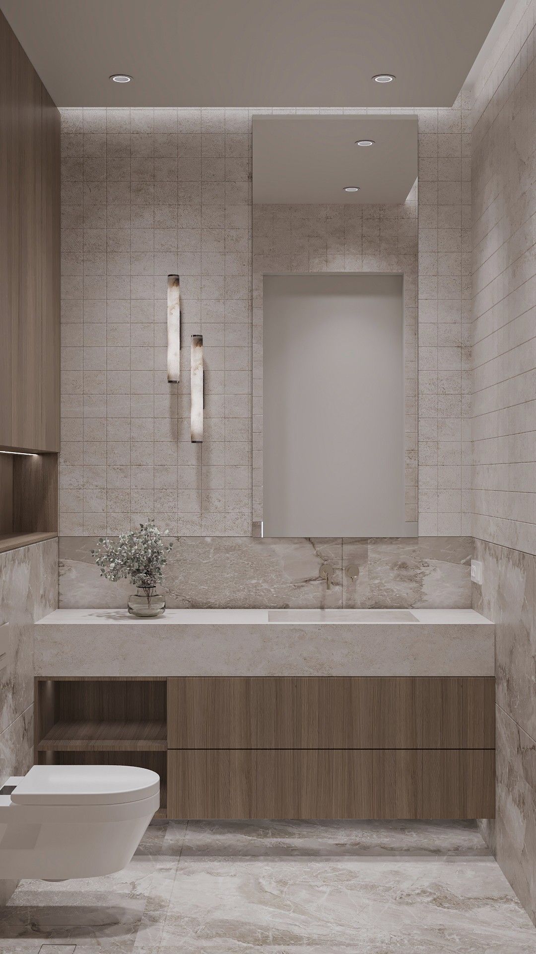 Bathroom — a long stone basin on timber drawers under a tall mirror, two slender wall lights on small-format tiles and a wall-hung WC.